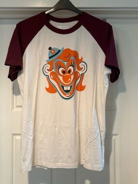 Big Bud Press White Tee with Maroon Raglan Sleeves and Orange Clown Graphic